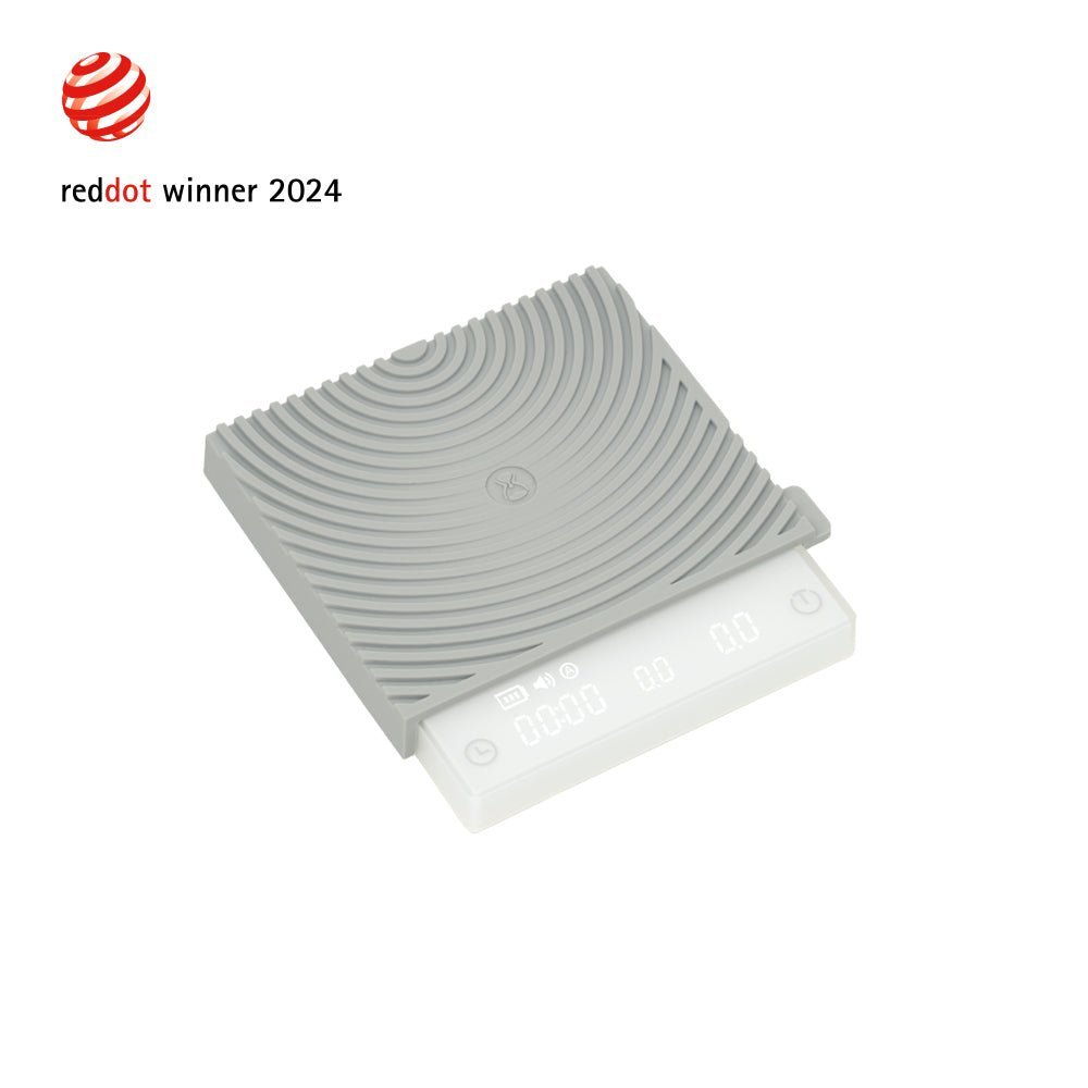 Gray textured mat with white base on a white background, featuring Red Dot Award logo.