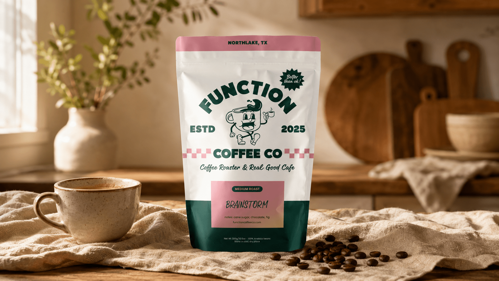 Function Coffee Co specialty whole bean coffee bag styled on a warm wood surface with ceramic cup and scattered coffee beans